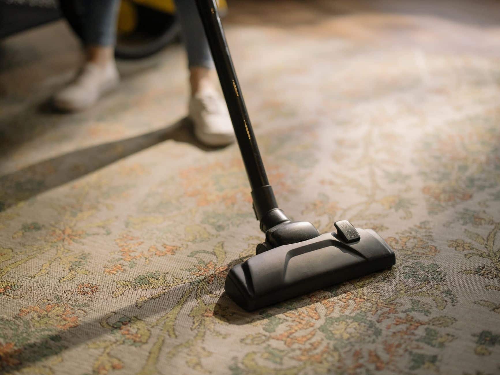 A carpet cleaner at work winning more carpet cleaning clients